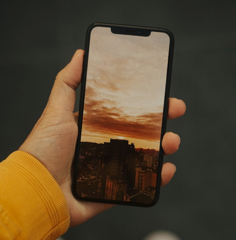 Hand holding a phone during a discovery call